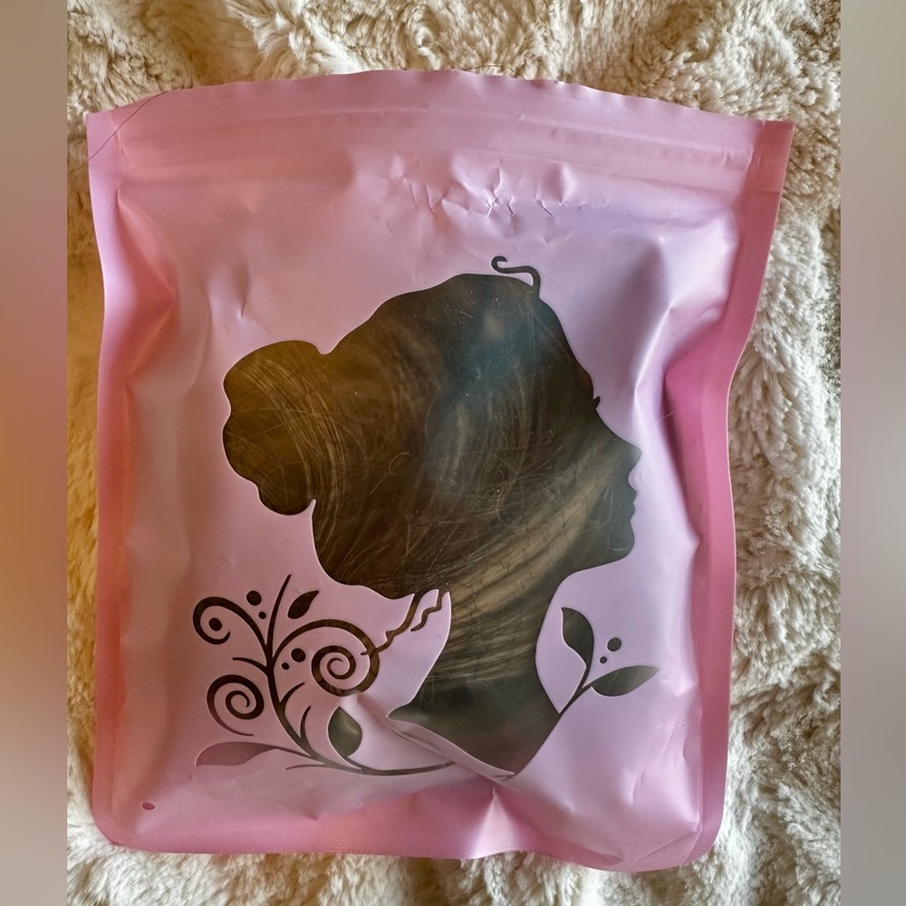 Kimi Hair synthetic hairpiece claw clip attachment. Lt brown/blonde highlights.